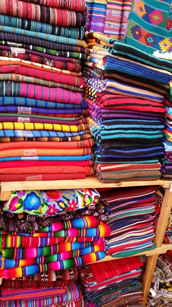 colorful stack of Native American blankets